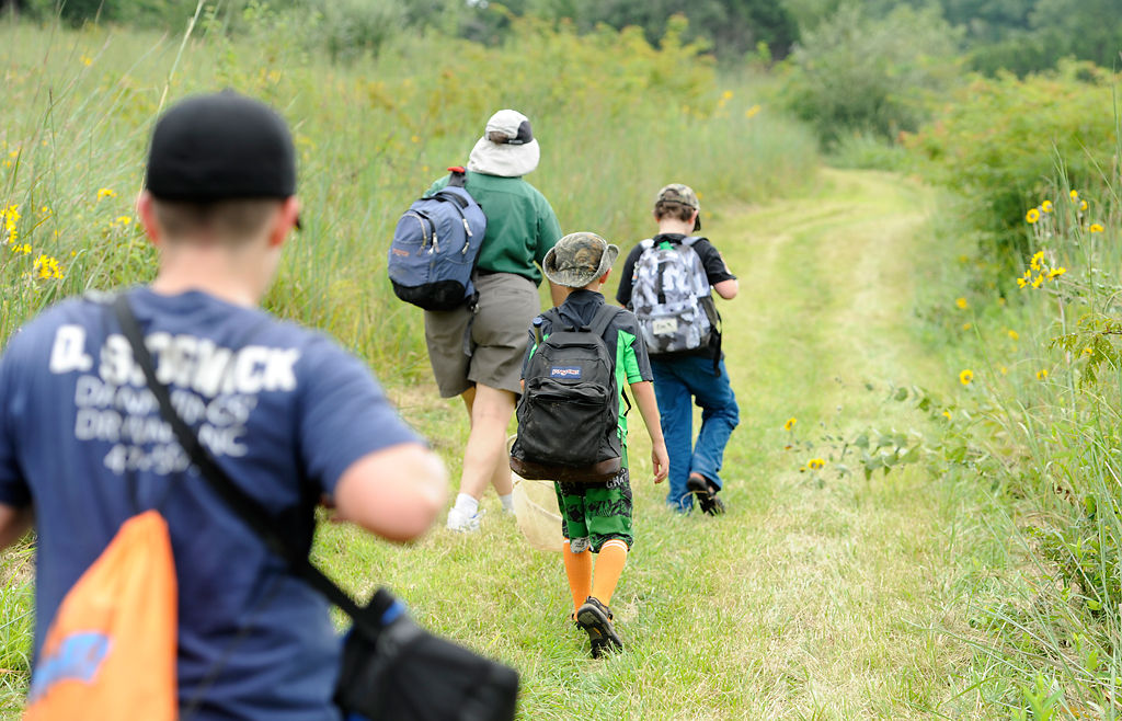 Roxie Campbell leads junior naturalists up High Ridge Trail